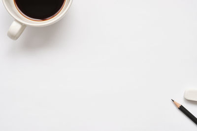 High angle view of coffee cup on table