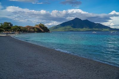 Scenic view of sea against cloudy sky