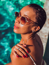 Portrait of a smiling young woman in swimming pool