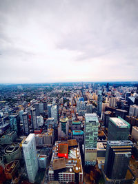 High angle view of modern buildings in city against sky