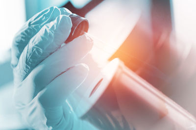 Cropped hands of scientist experimenting in laboratory