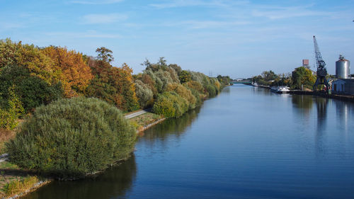 Scenic view of river against sky during autumn