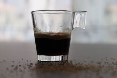 Close-up of coffee in glass on table