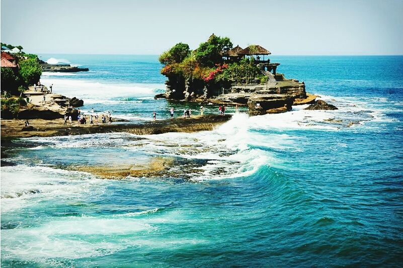 sea, horizon over water, water, scenics, tranquil scene, beauty in nature, tranquility, beach, clear sky, blue, nature, cliff, rock formation, wave, shore, rock - object, idyllic, seascape, coastline, sky