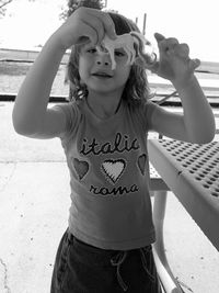 Portrait of smiling girl standing outdoors