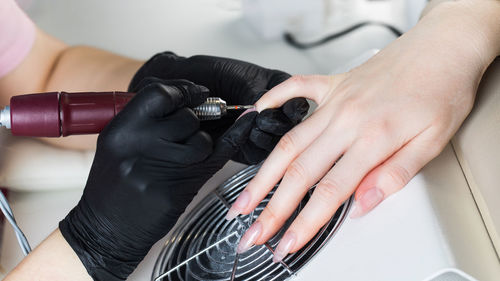 Hardware manicure. manicure process, cuticle removal with a cutter. processing 