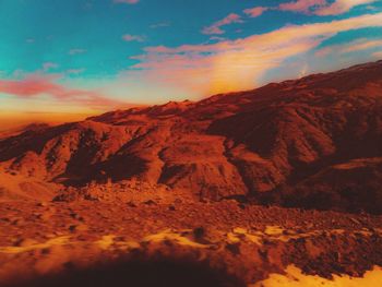 Scenic view of mountains against sky during sunset