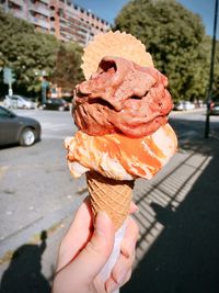 Midsection of person holding ice cream cone