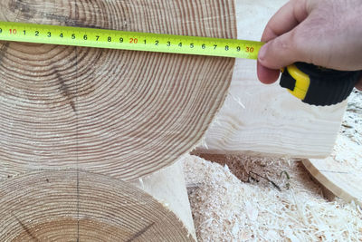 Close-up of person working on wood