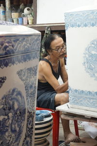 Woman sitting on table