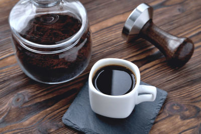 High angle view of coffee cup on table