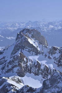 Scenic view of snowcapped mountains against sky