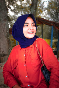 Portrait of smiling young woman in winter