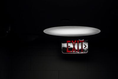 Illuminated electric lamp on wall