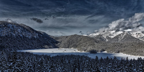 Scenic view of snowcapped mountains against sky