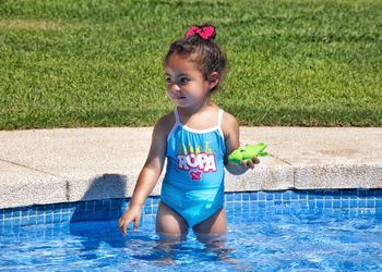 Cute girl in swimming pool