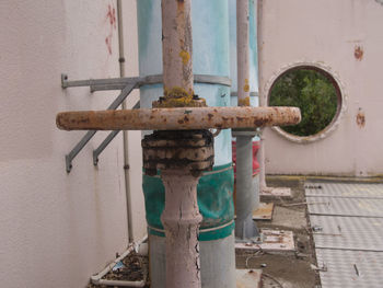 Close-up of pipe against wall