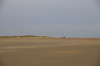 Scenic view of desert against clear sky