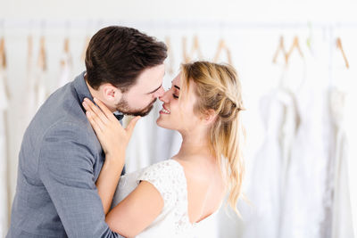 Side view of a young couple kissing