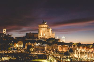 Illuminated buildings in city at night