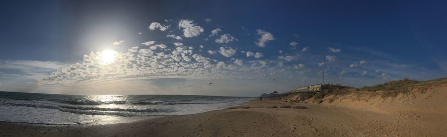 Scenic view of beach against sky during sunset