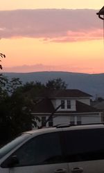 Scenic view of mountains against sky at sunset