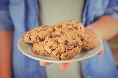 Close-up of hand holding cookies