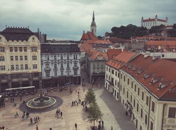 High angle view of people amidst buildings in town