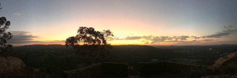 Scenic view of silhouette landscape against sky during sunset