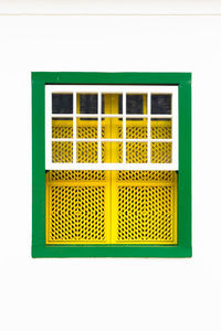 Close-up of yellow window against white background