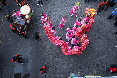 High angle view of people dancing on road in city