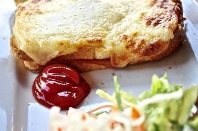 Close-up of croque monsieur with ketchup in plate