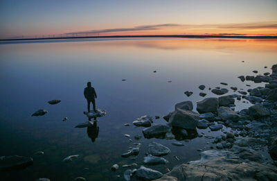 Scenic view of lake against sky during sunset