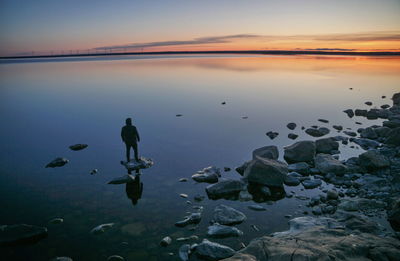 Scenic view of lake against sky during sunset