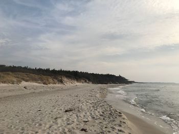 Scenic view of beach against sky