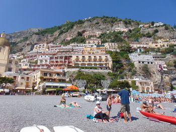 High angle view of people on mountain against clear sky