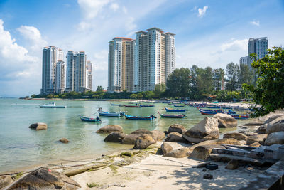 Buildings in city against sky