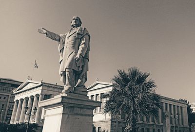 Low angle view of statue against sky