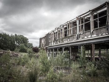 Built structure against cloudy sky