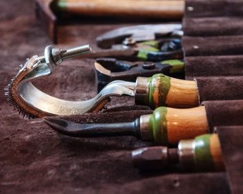 Close-up of various work tools in bag