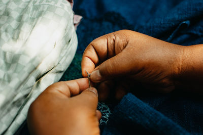 Close-up of man holding hands