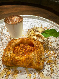 Warm apple strudel accompanied with ice cream.