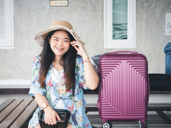 Travel concept from young asian woman in summer clothes smiling cheerful and happy.