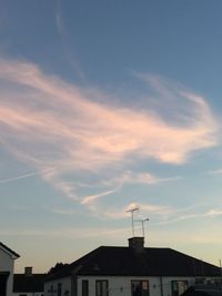 Low angle view of house against cloudy sky