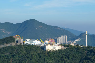 High angle view of hong kong ocean park in mountains and against sky