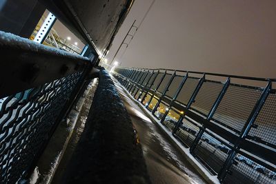 Train on bridge over sea against clear sky