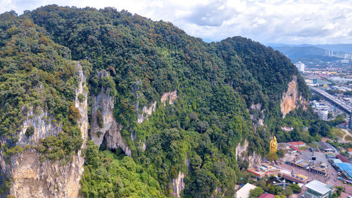 High angle view of trees and mountains against sky