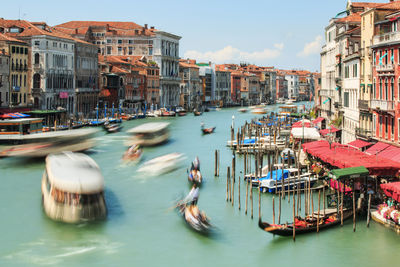 Blurred motion of gondolas in canal