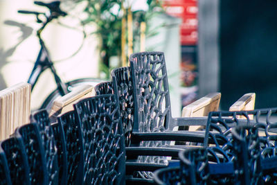 Empty chairs and tables in row