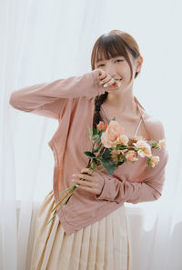 Young woman with bouquet